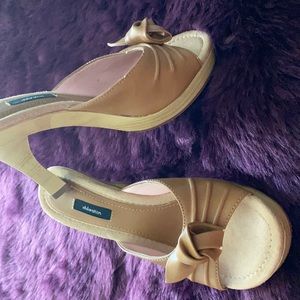 Size 8 1/2, 4 inch beige heel.